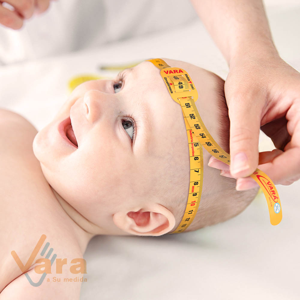 Professional pediatrician examining smiling baby